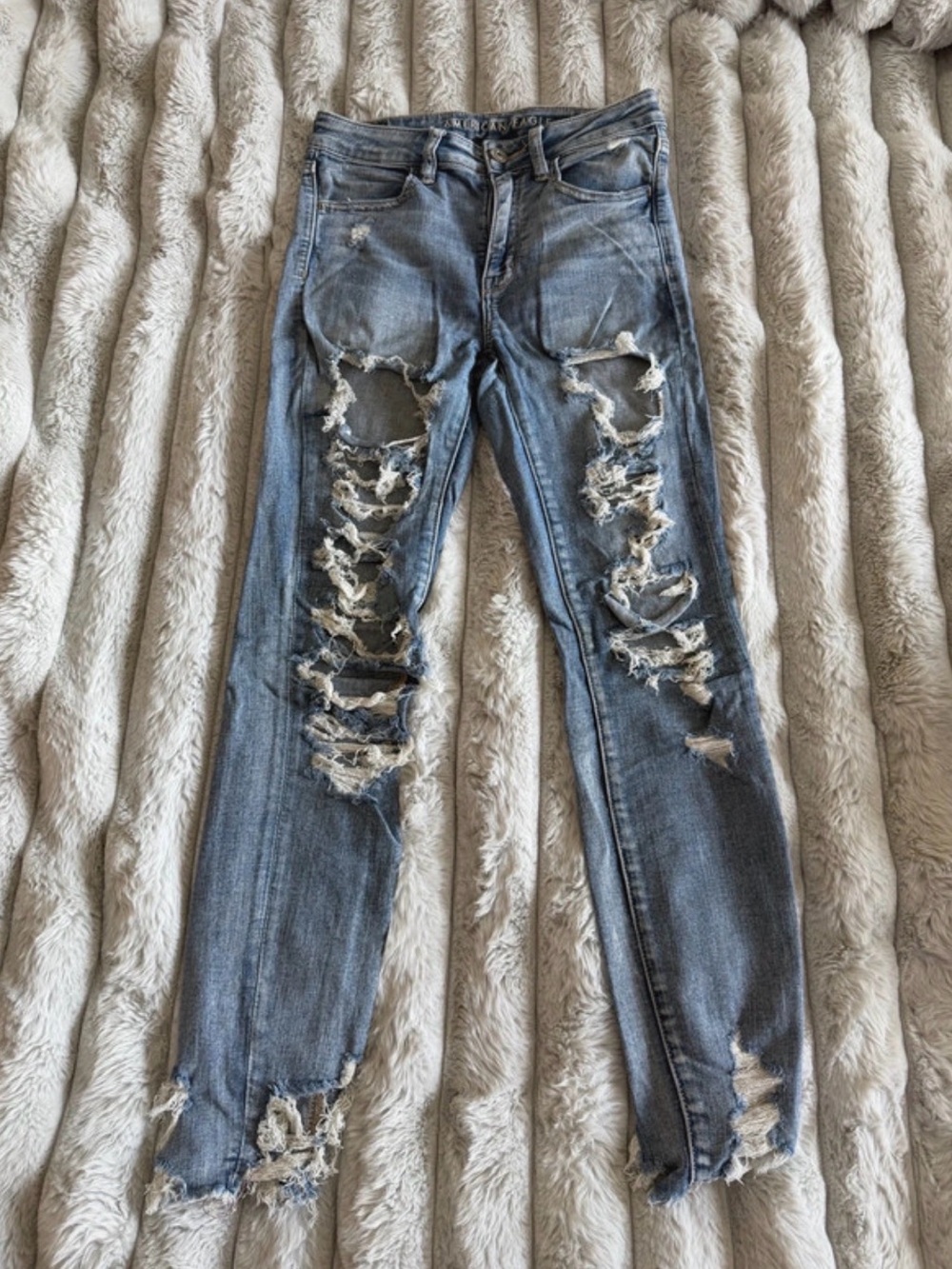 American Eagle Outfitters Light Blue Skinny Jeans with Distressed Hem